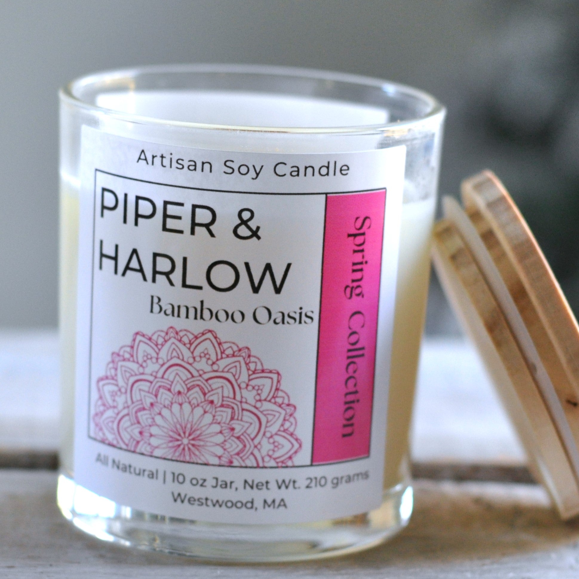 Bamboo Oasis scented soy candle in clear glass jar with wood wick.