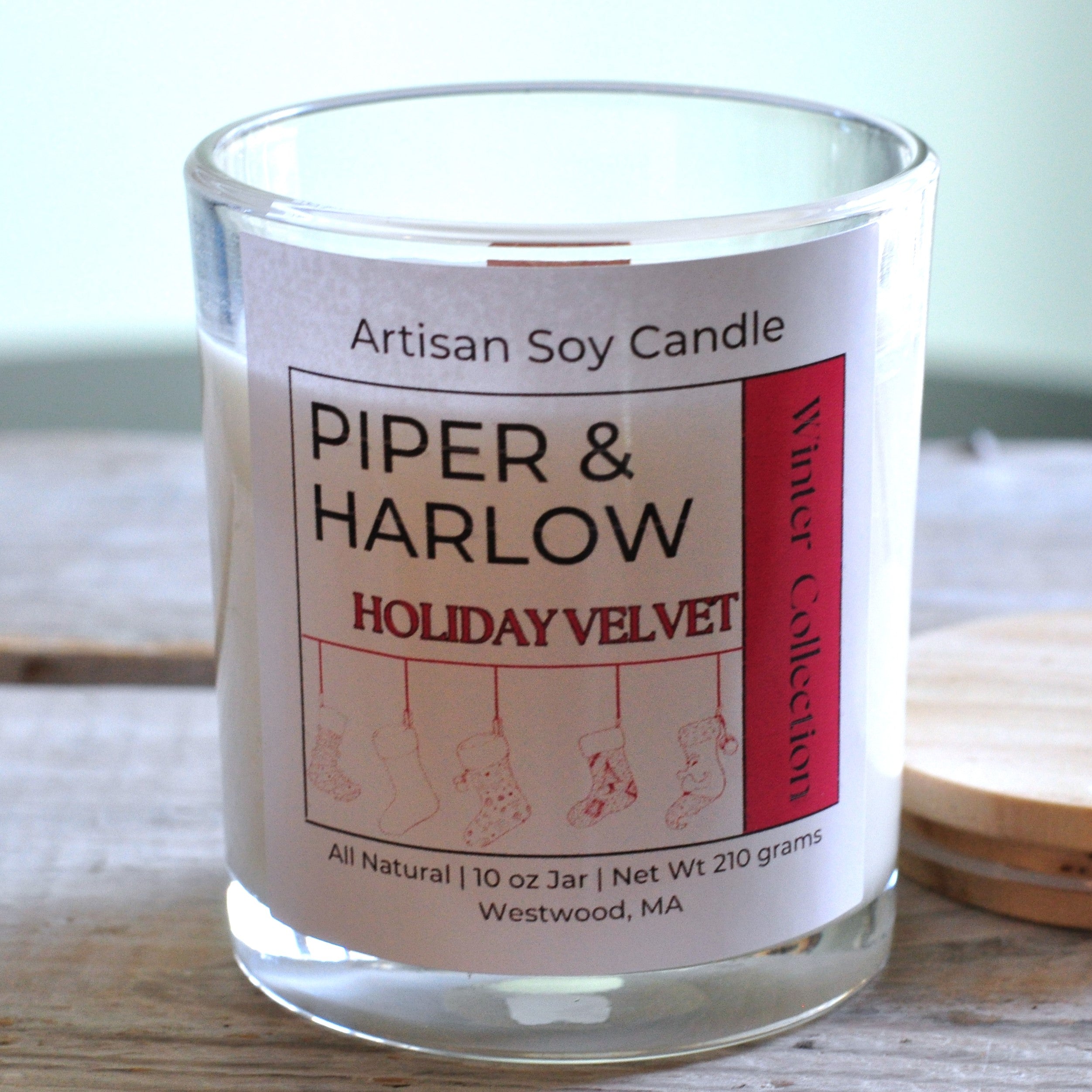Holiday Velvet scented soy candle in clear glass jar with wood wick and wood lid