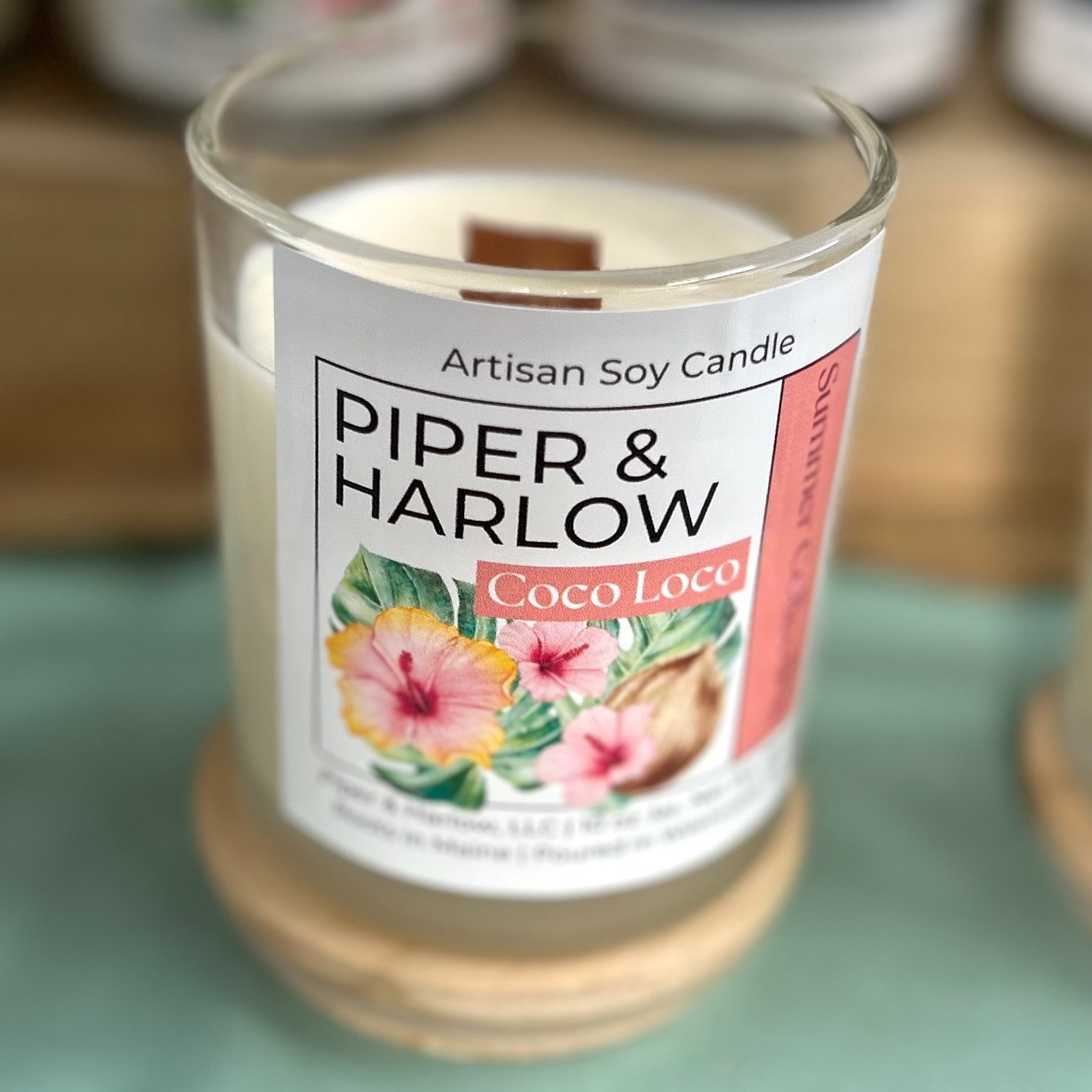 glass candle with wood wick coconut fragrance called coco loco