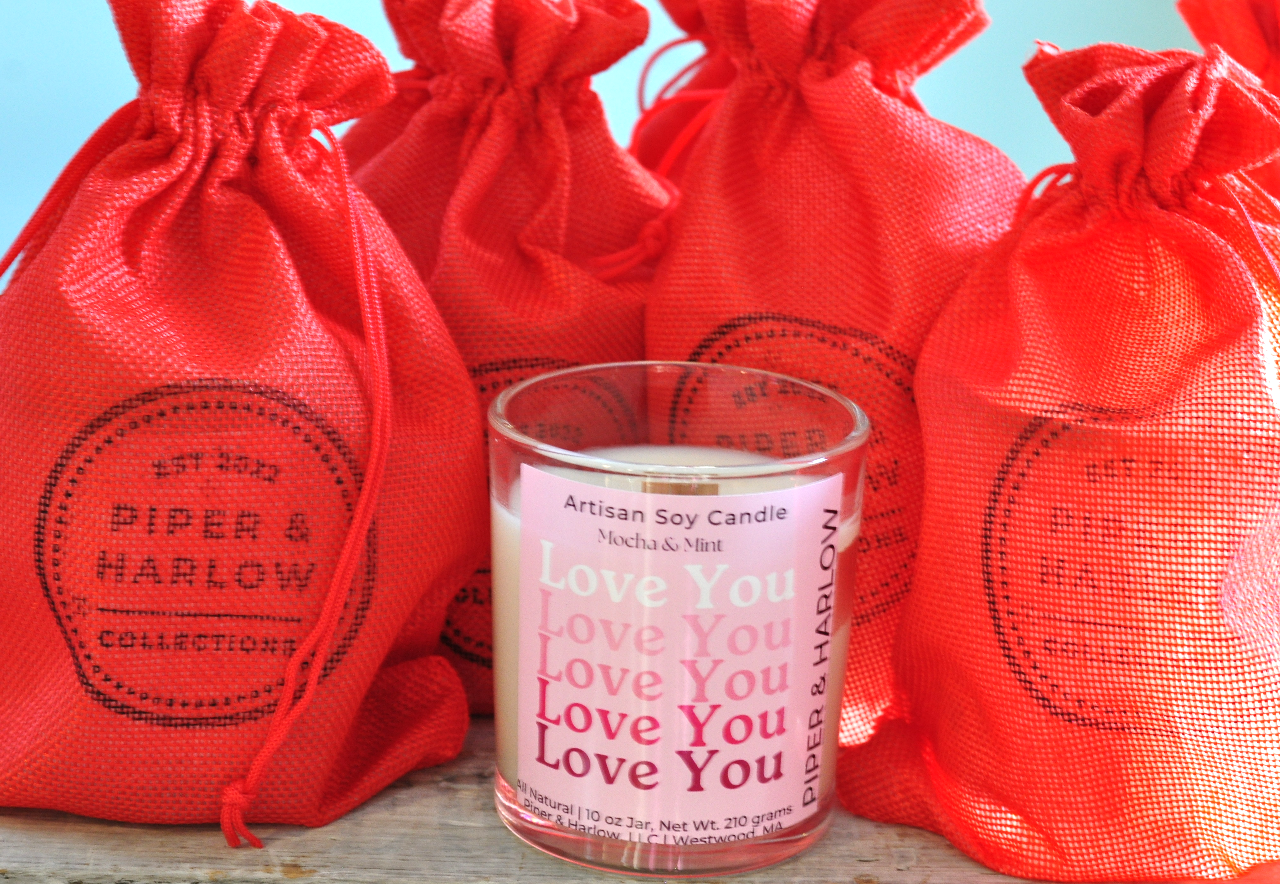 Love you label on glass soy candle with red burlap gift bags