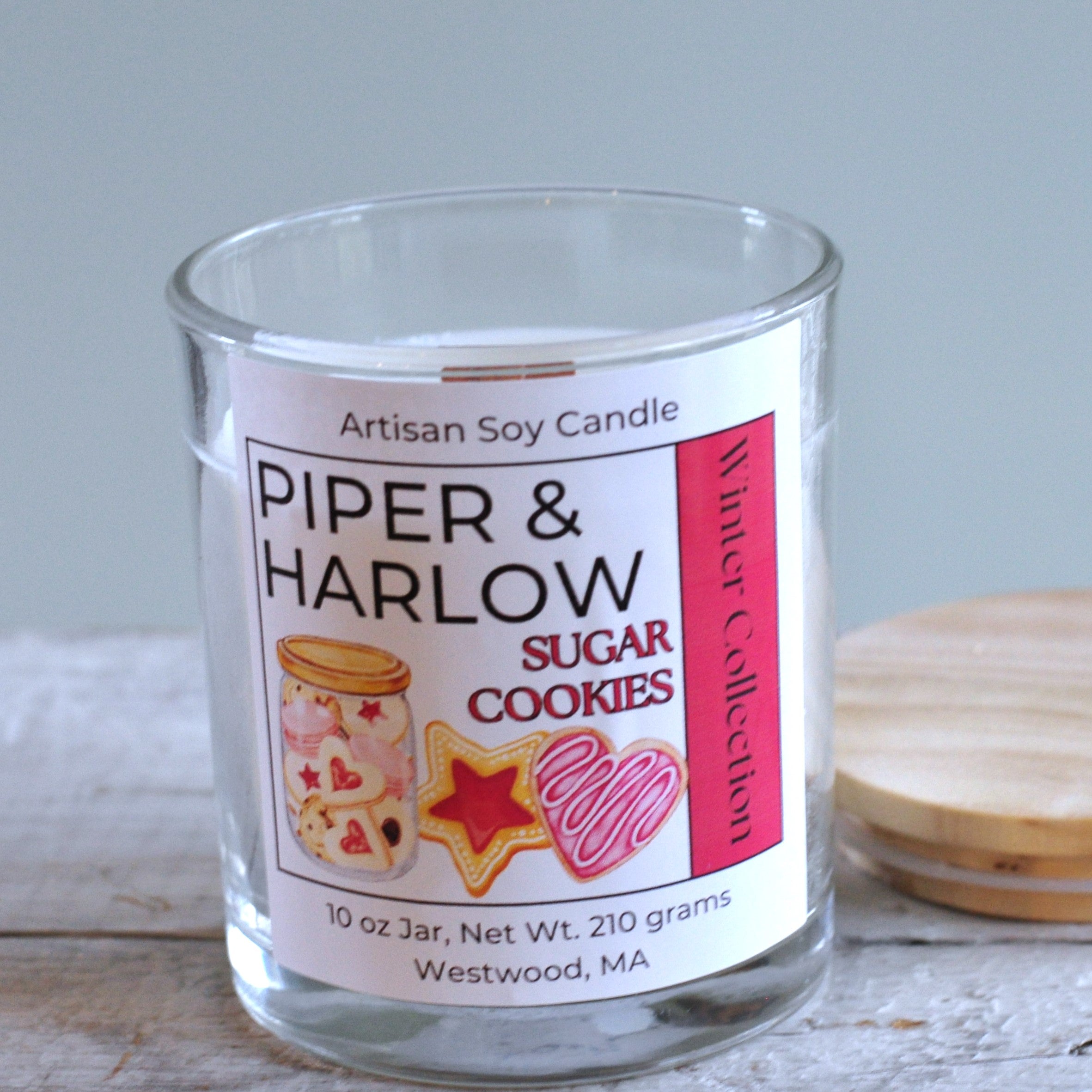 Sugar cookie scented candle in glass jar with wood wick.