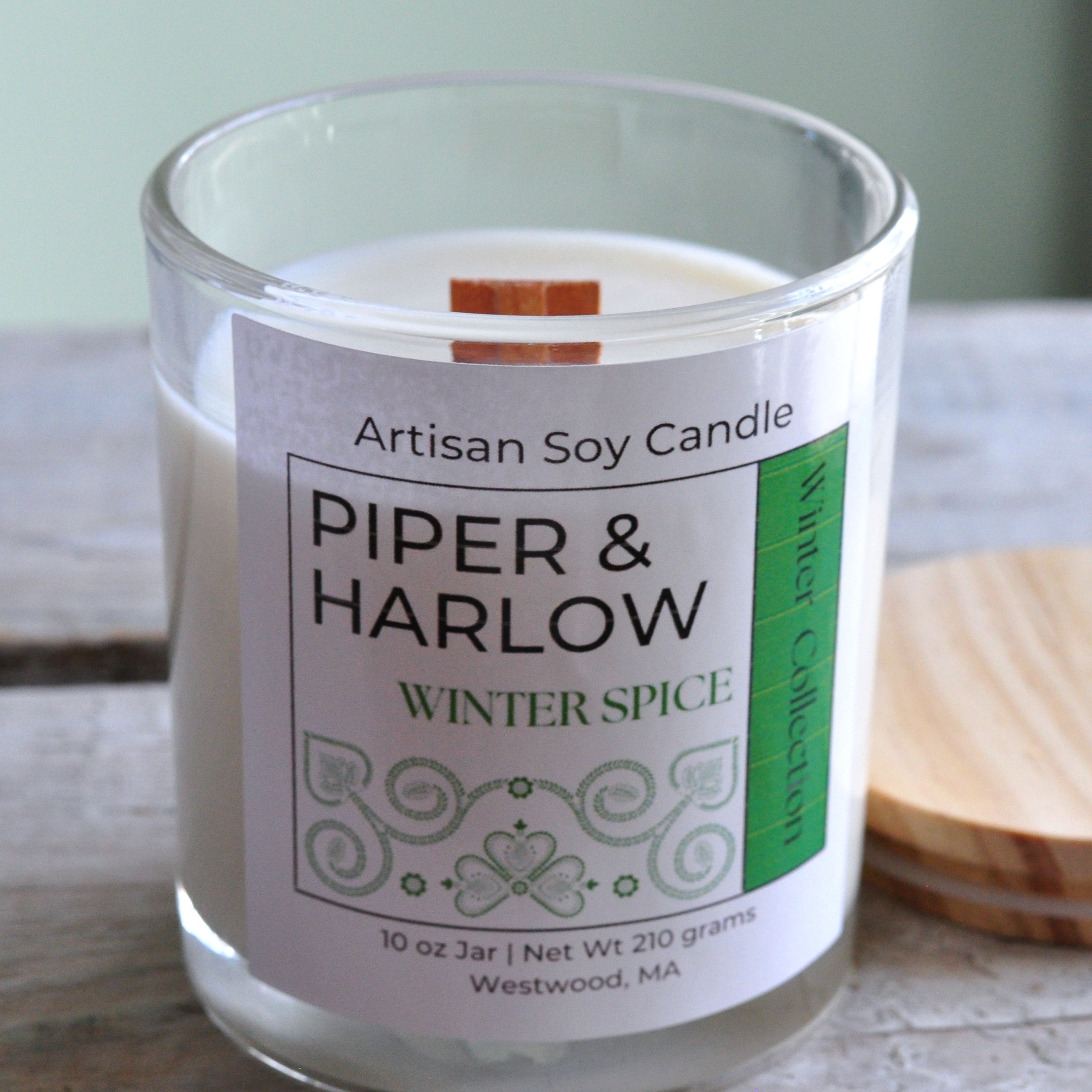 Glass jar candle in scent winter spice with wood wick.