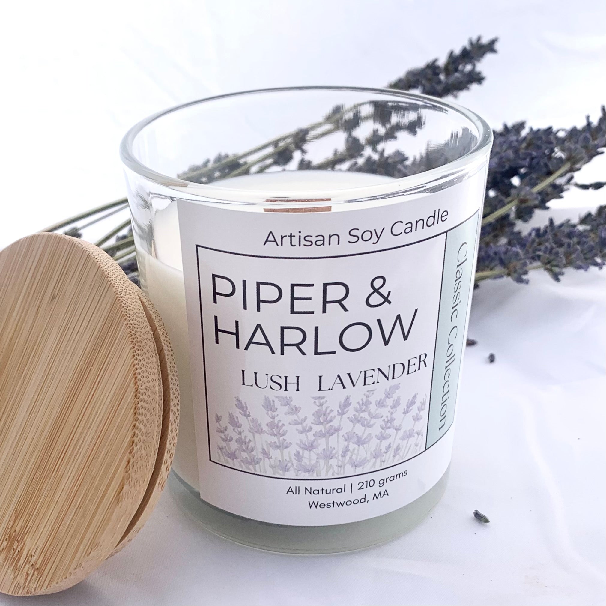Lavender soy candle in glass jar with decorative lavender flowers