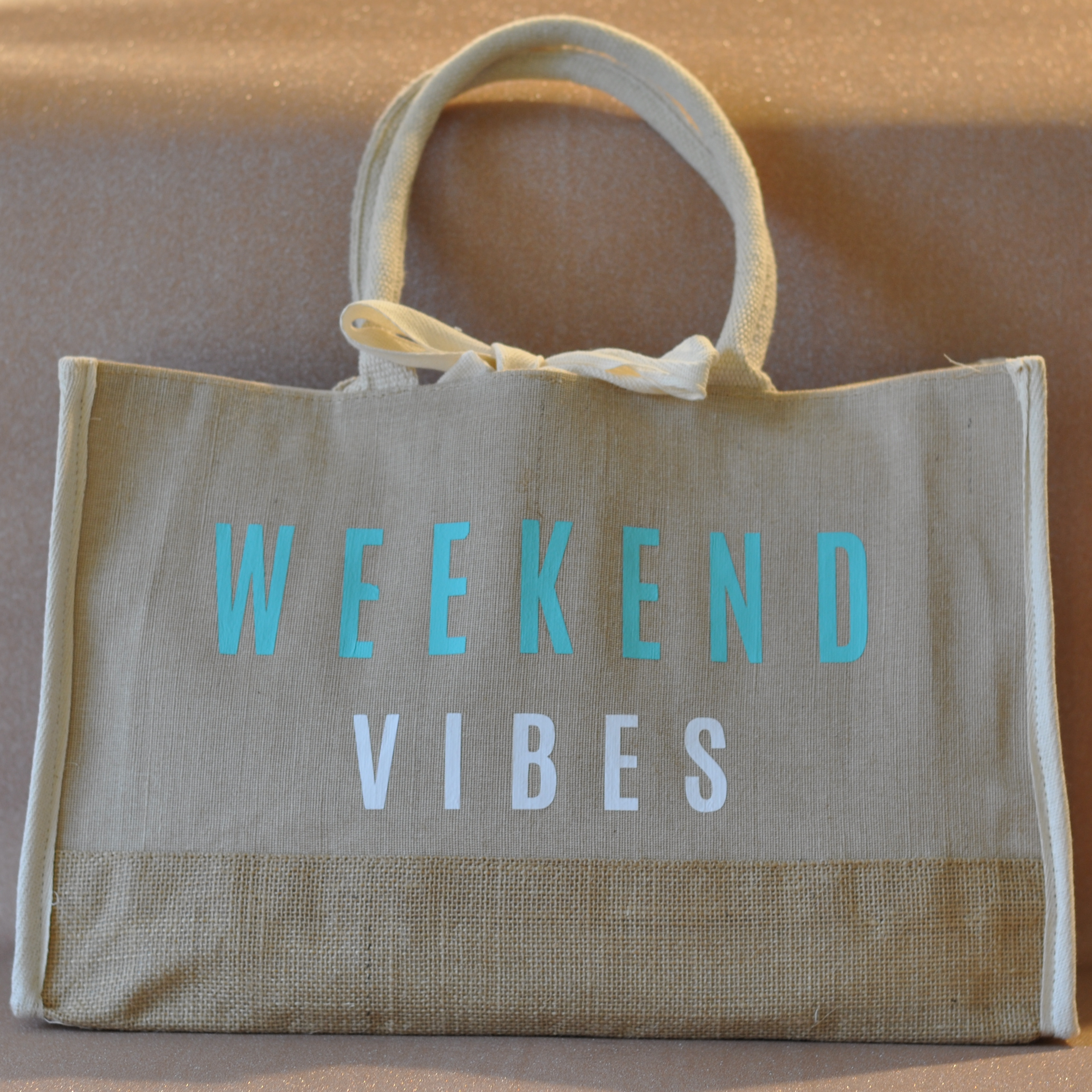 Jute tote bag with Weekend Vibes saying.