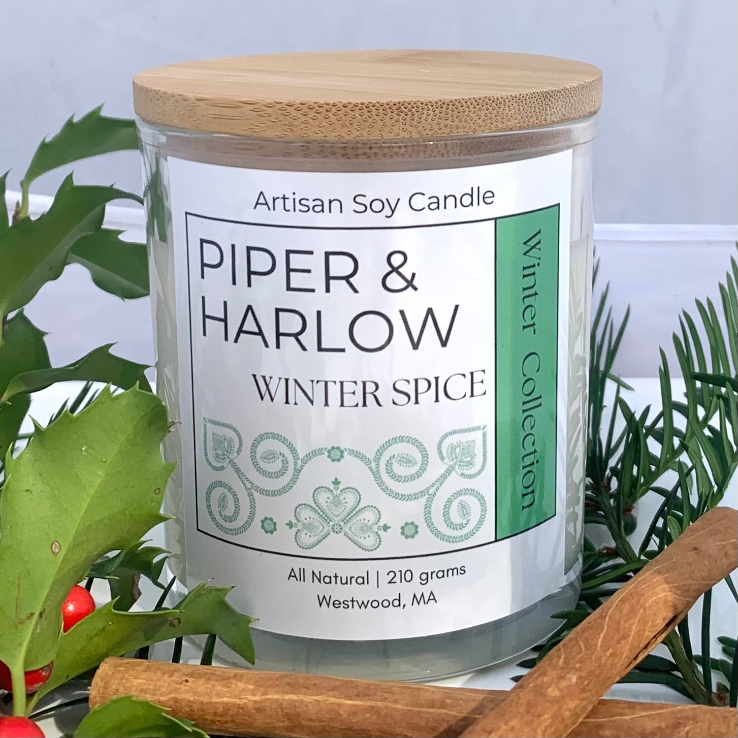 Winter Spice scented candle with wood lid and holiday decor.
