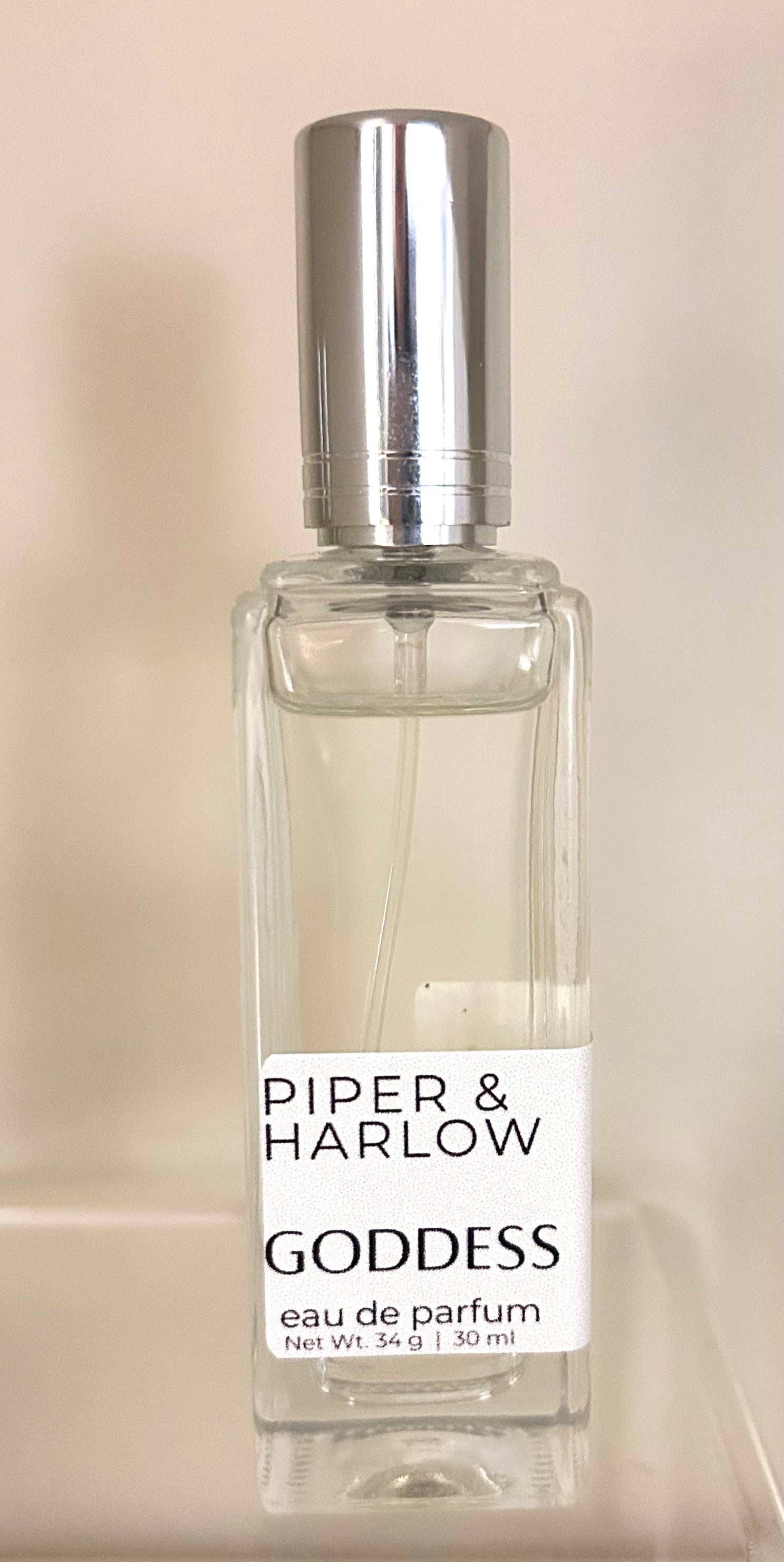 Piper & Harlow Goddess eau de parfum bottle on a beige background