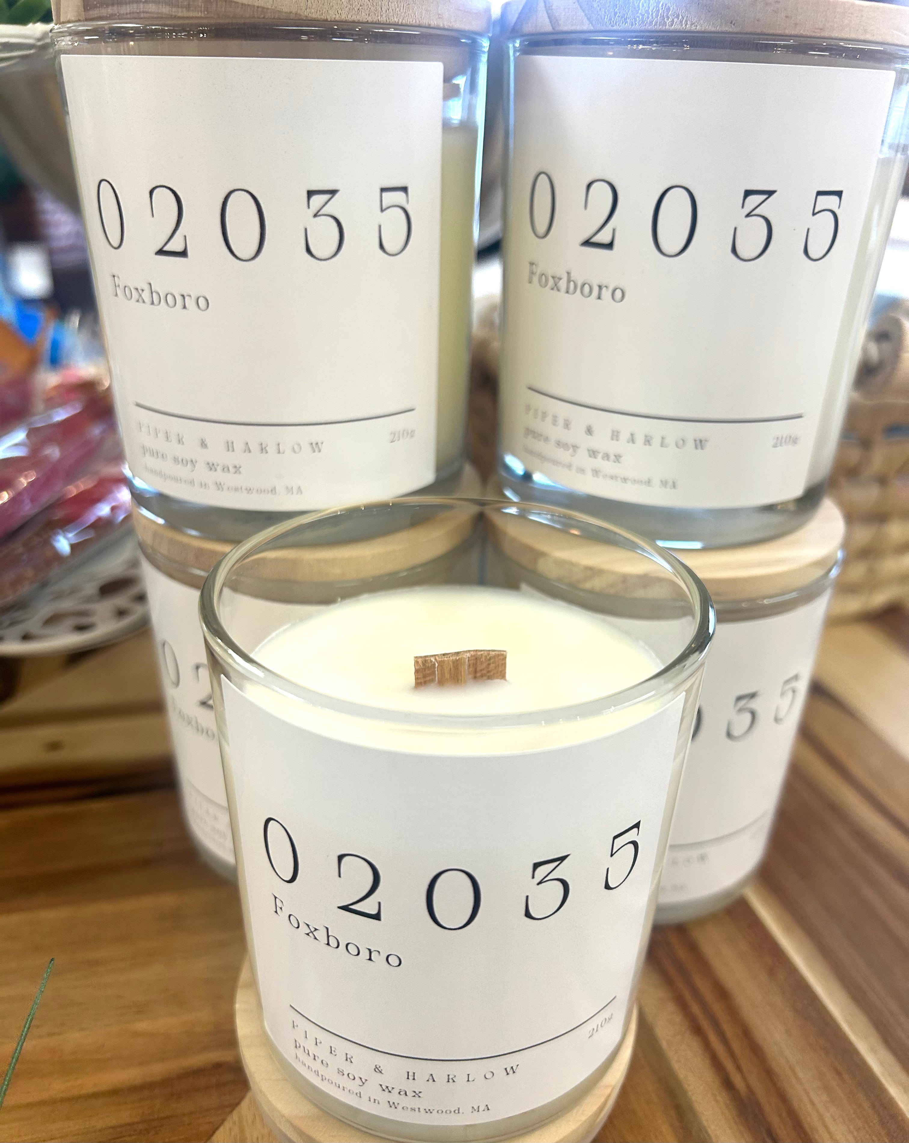 Zipcode candle in glass jar with wood wick. White zipcode label.