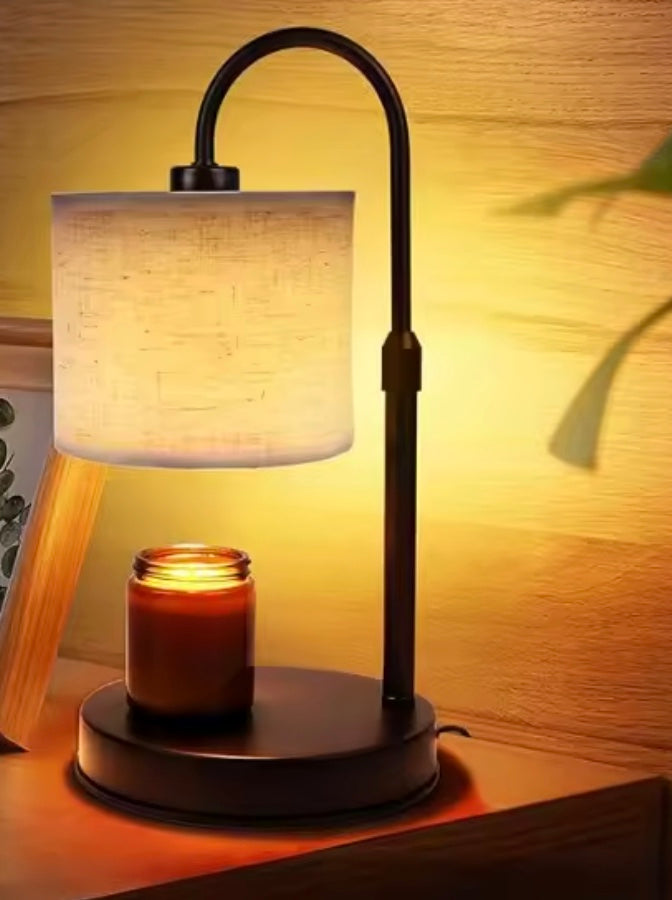 Table lamp with a candle on a wooden surface