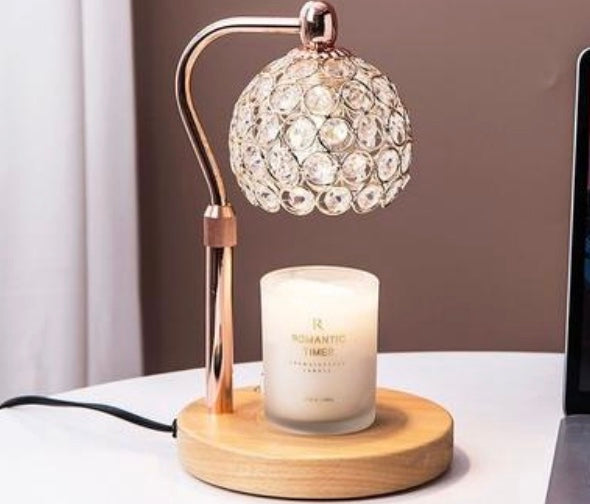 Decorative lamp with crystal shade and candle on a wooden base